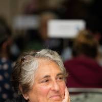 A woman listens attentively during the round table conversations.